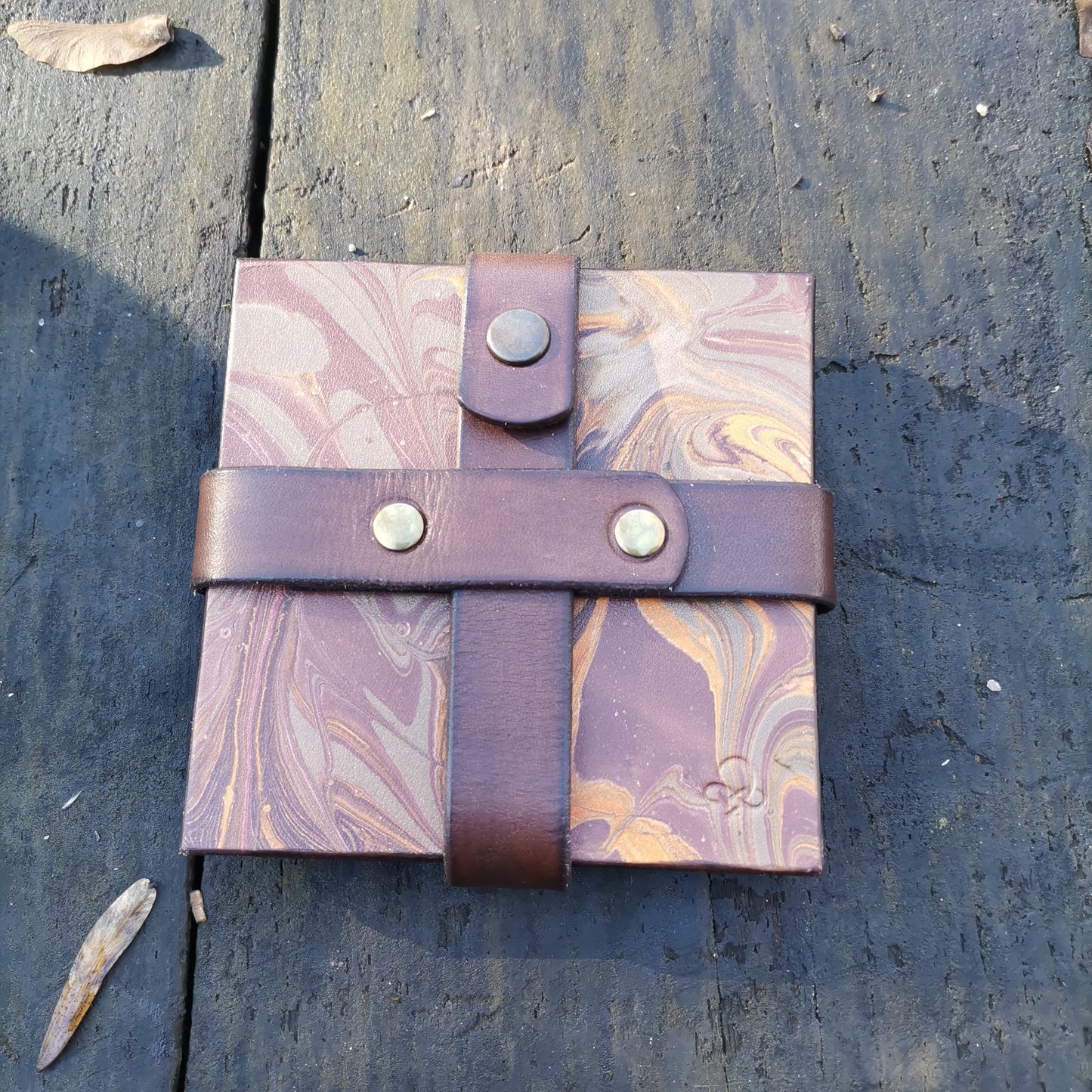 Leather coasters with brown marbling