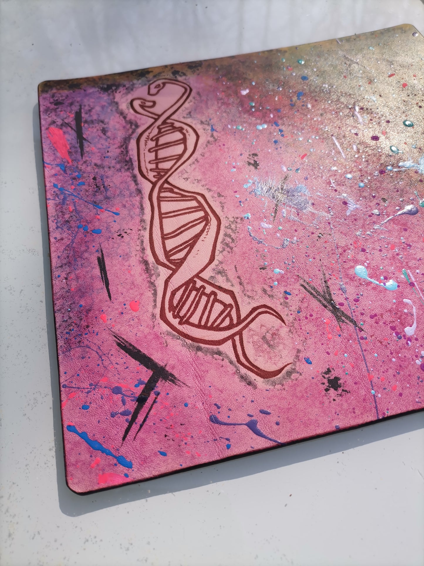Leather Moodmat with pink marbling and DNA snake engraving